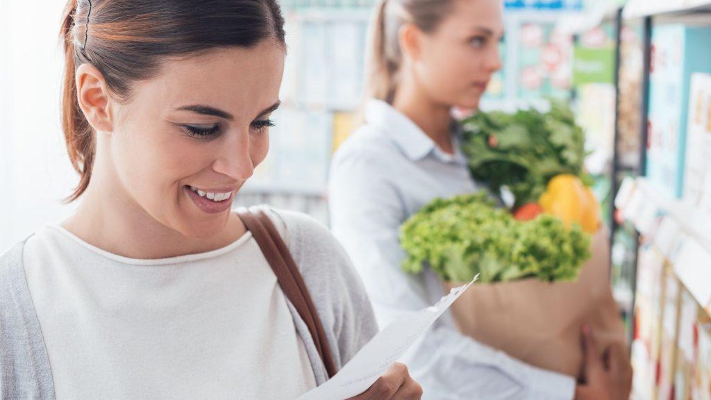 women shopping with a grocery list